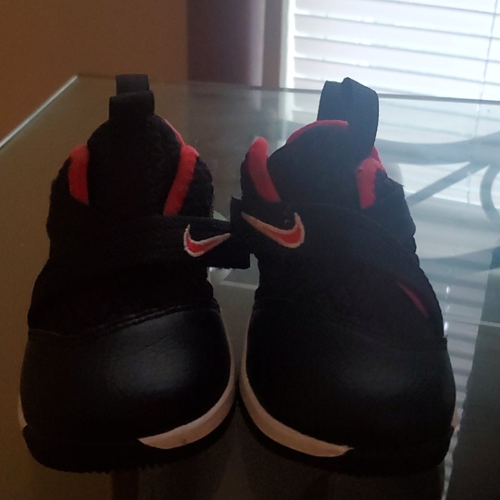 Red and black little boy Nikes